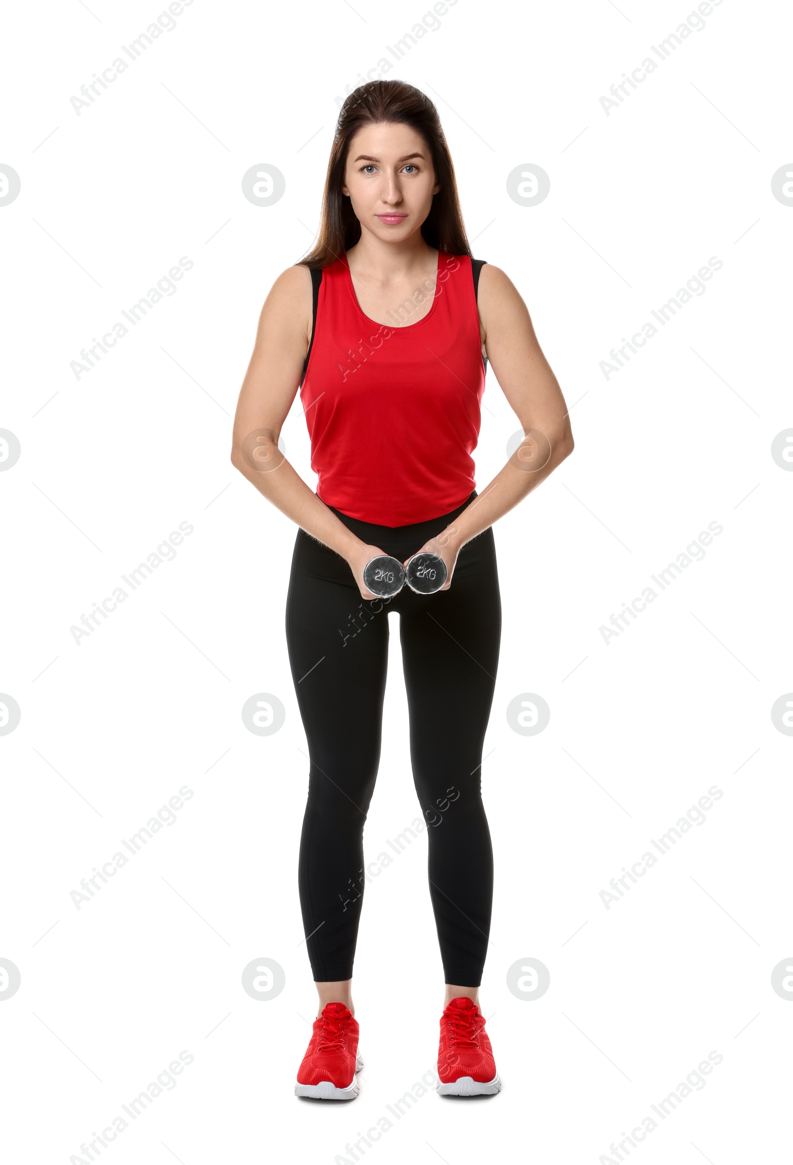 Photo of Woman in sportswear exercising with dumbbells on white background