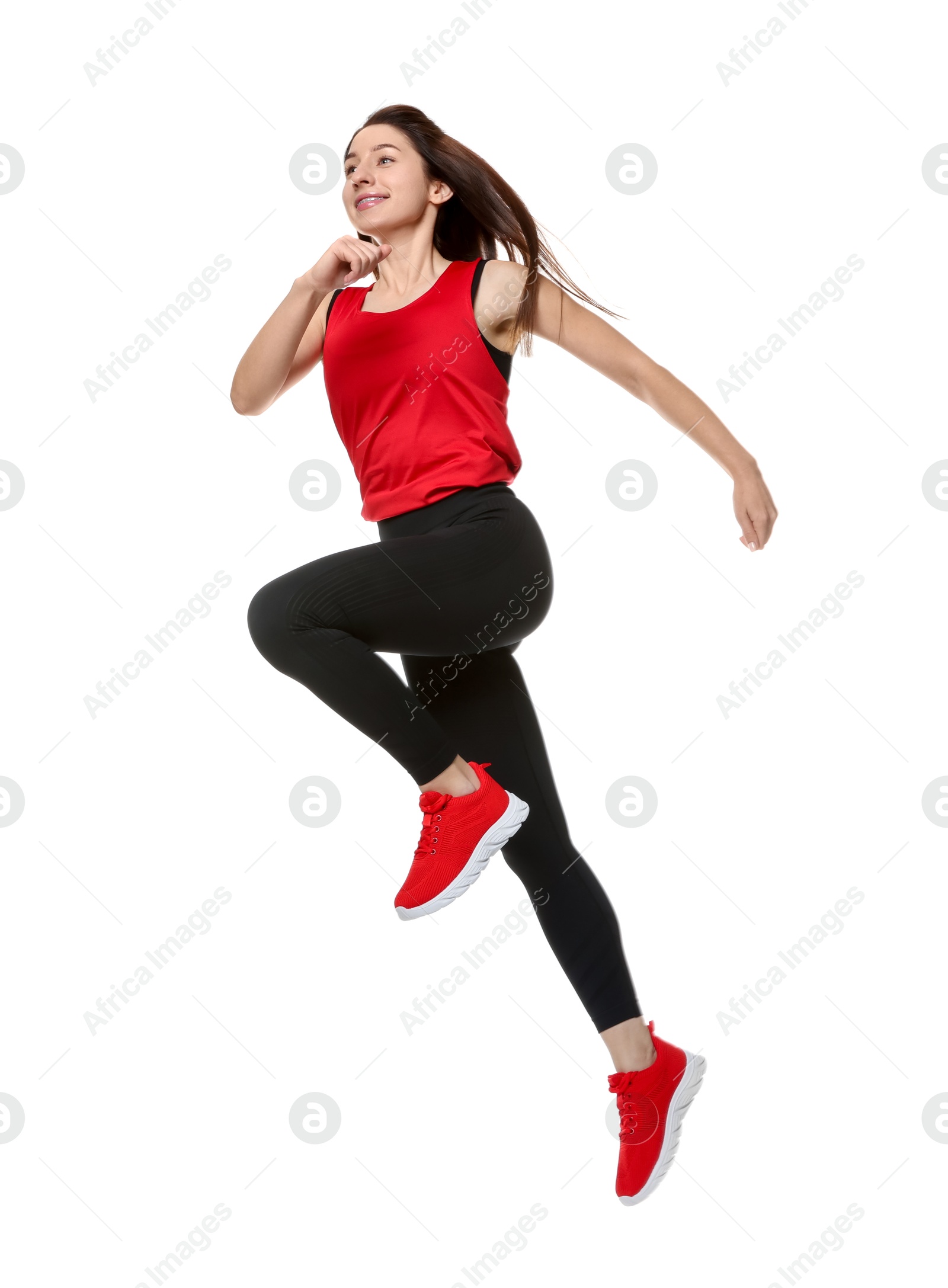 Photo of Woman in sportswear exercising on white background