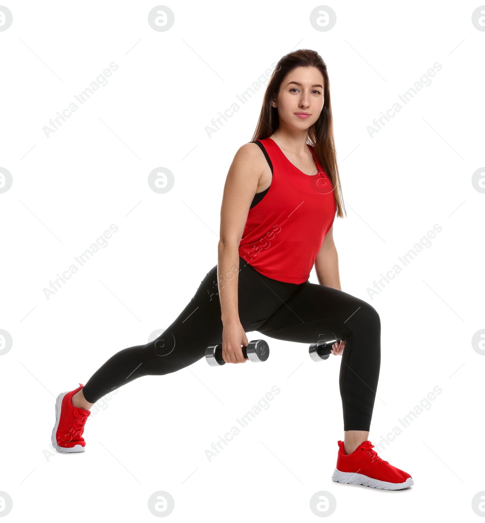 Photo of Woman in sportswear exercising with dumbbells on white background