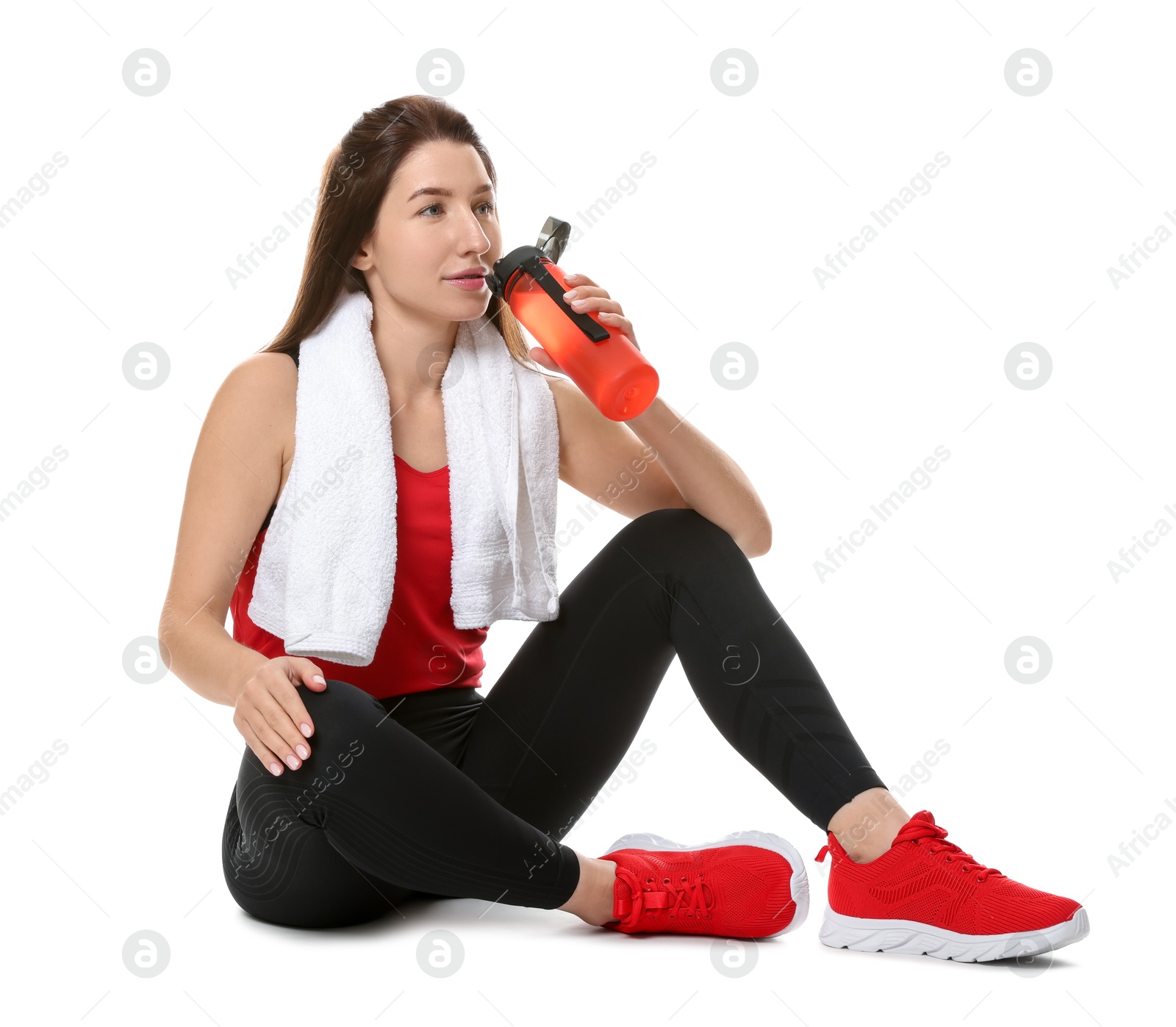 Photo of Woman in sportswear with bottle of water on white background