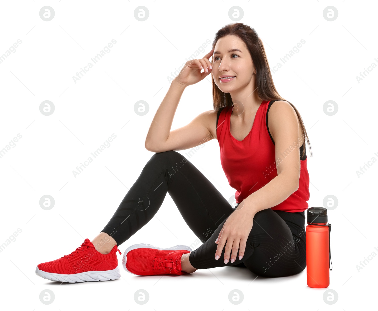 Photo of Woman in sportswear with bottle of water on white background