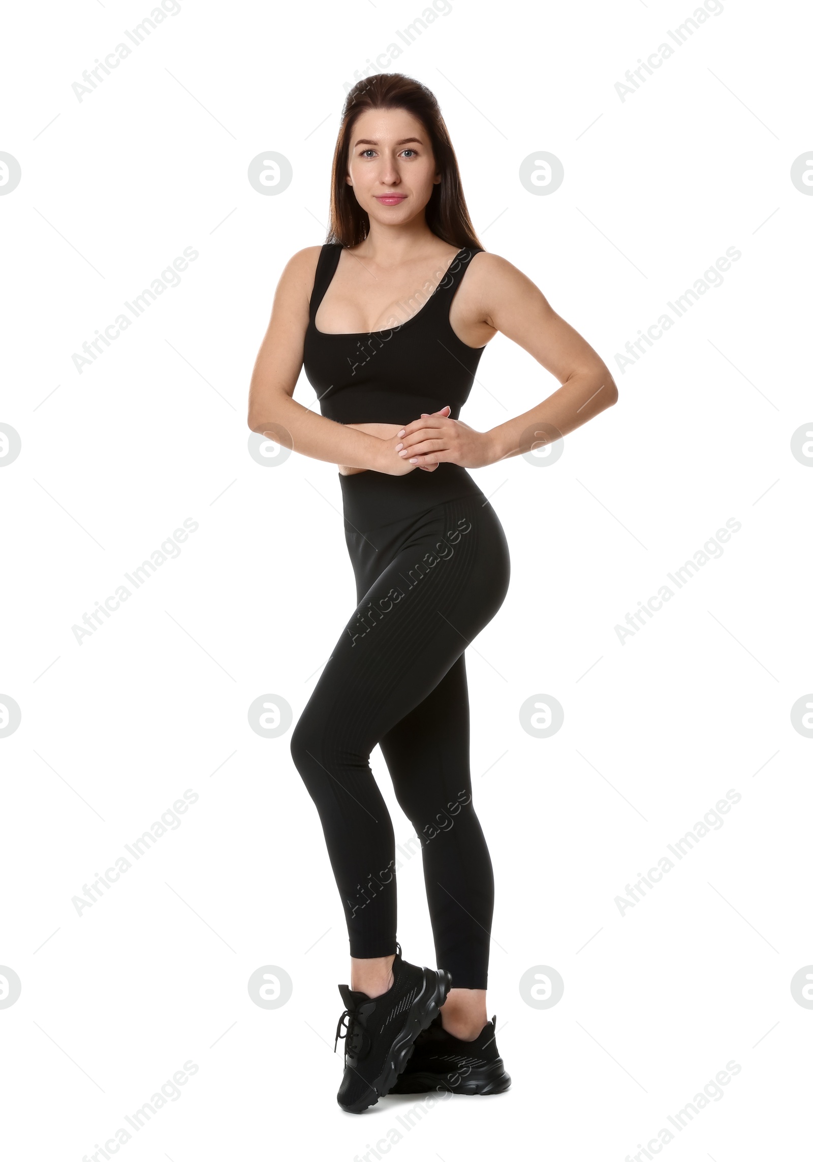 Photo of Portrait of woman in sportswear on white background