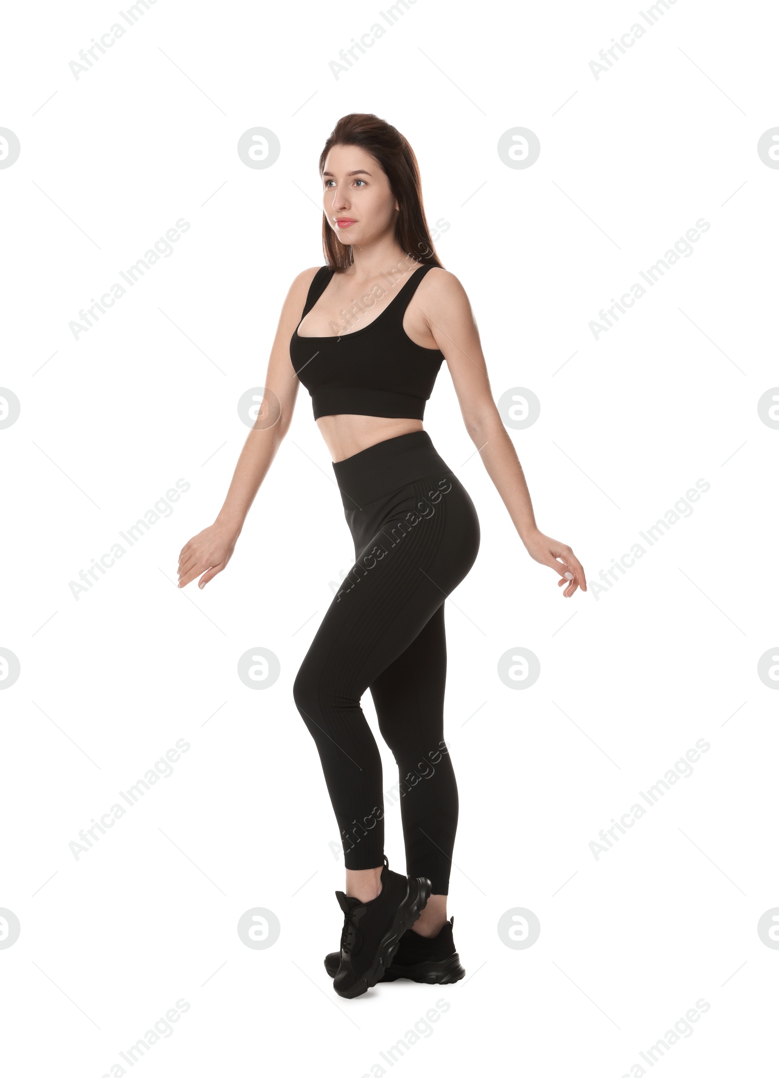 Photo of Portrait of woman in sportswear on white background