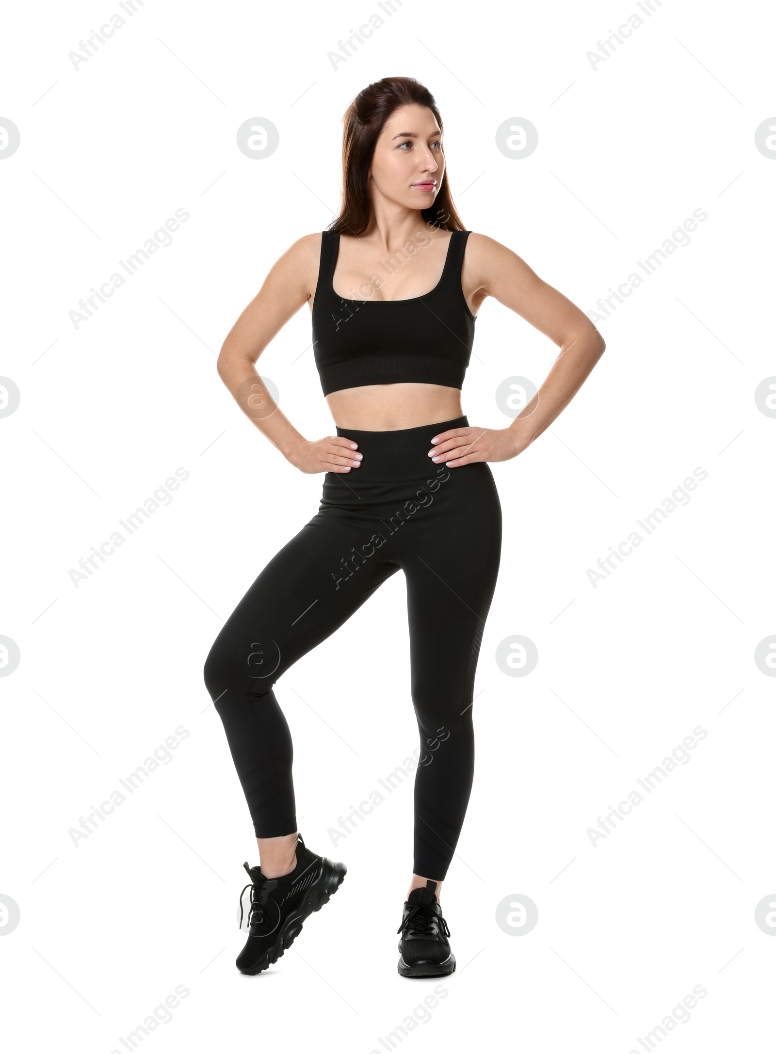 Photo of Portrait of woman in sportswear on white background