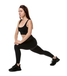 Photo of Woman in sportswear exercising on white background