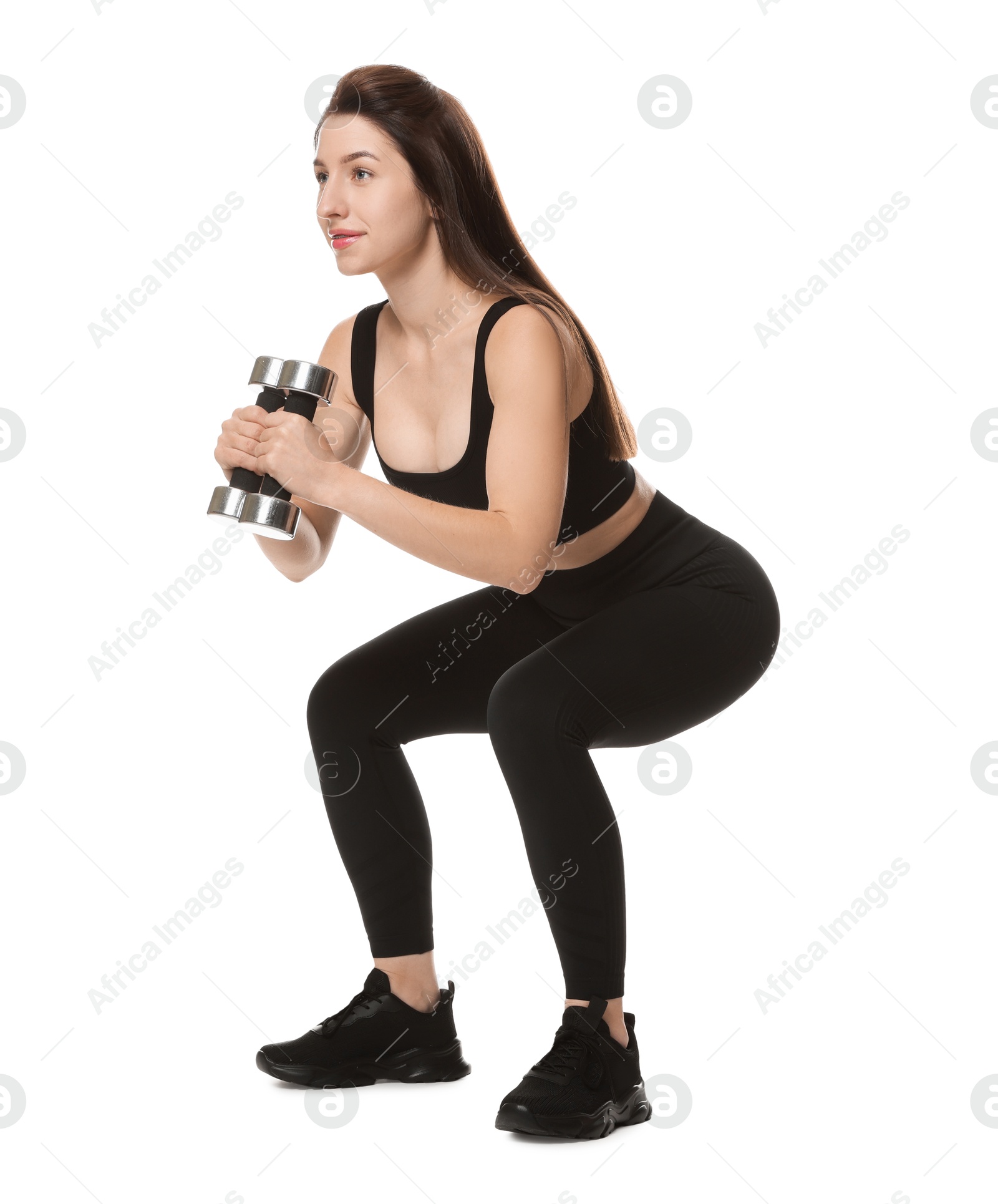 Photo of Woman in sportswear exercising with dumbbells on white background