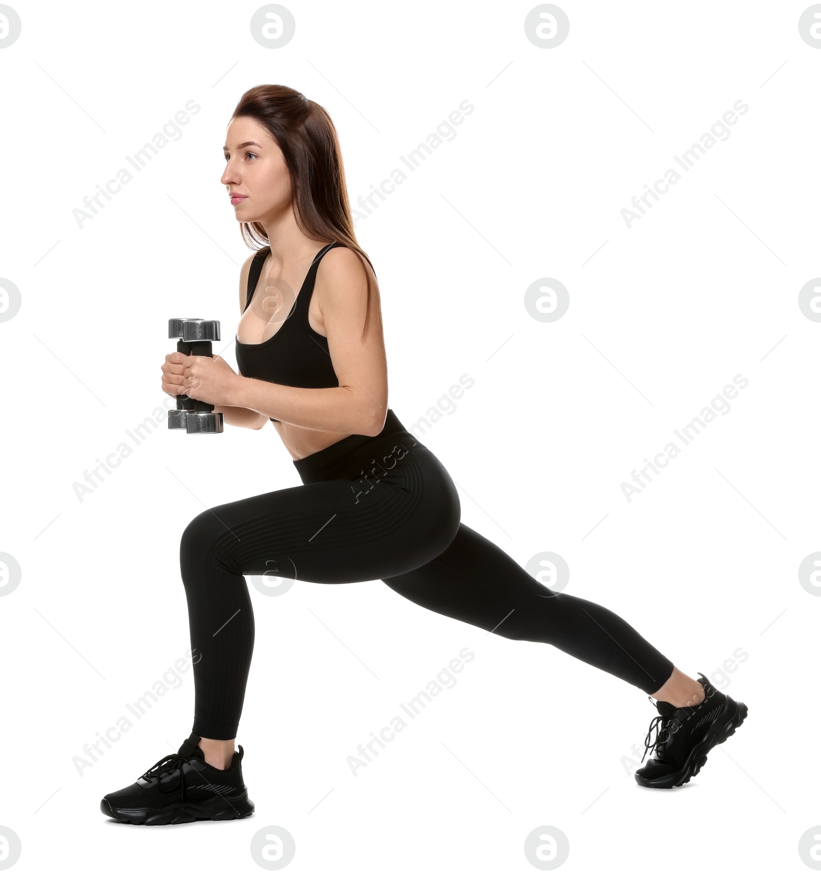 Photo of Woman in sportswear exercising with dumbbells on white background