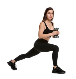 Woman in sportswear exercising with dumbbells on white background