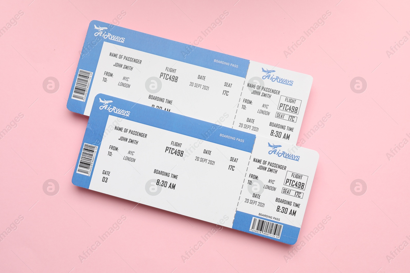 Photo of Travel agency. Flight tickets on pink background, top view