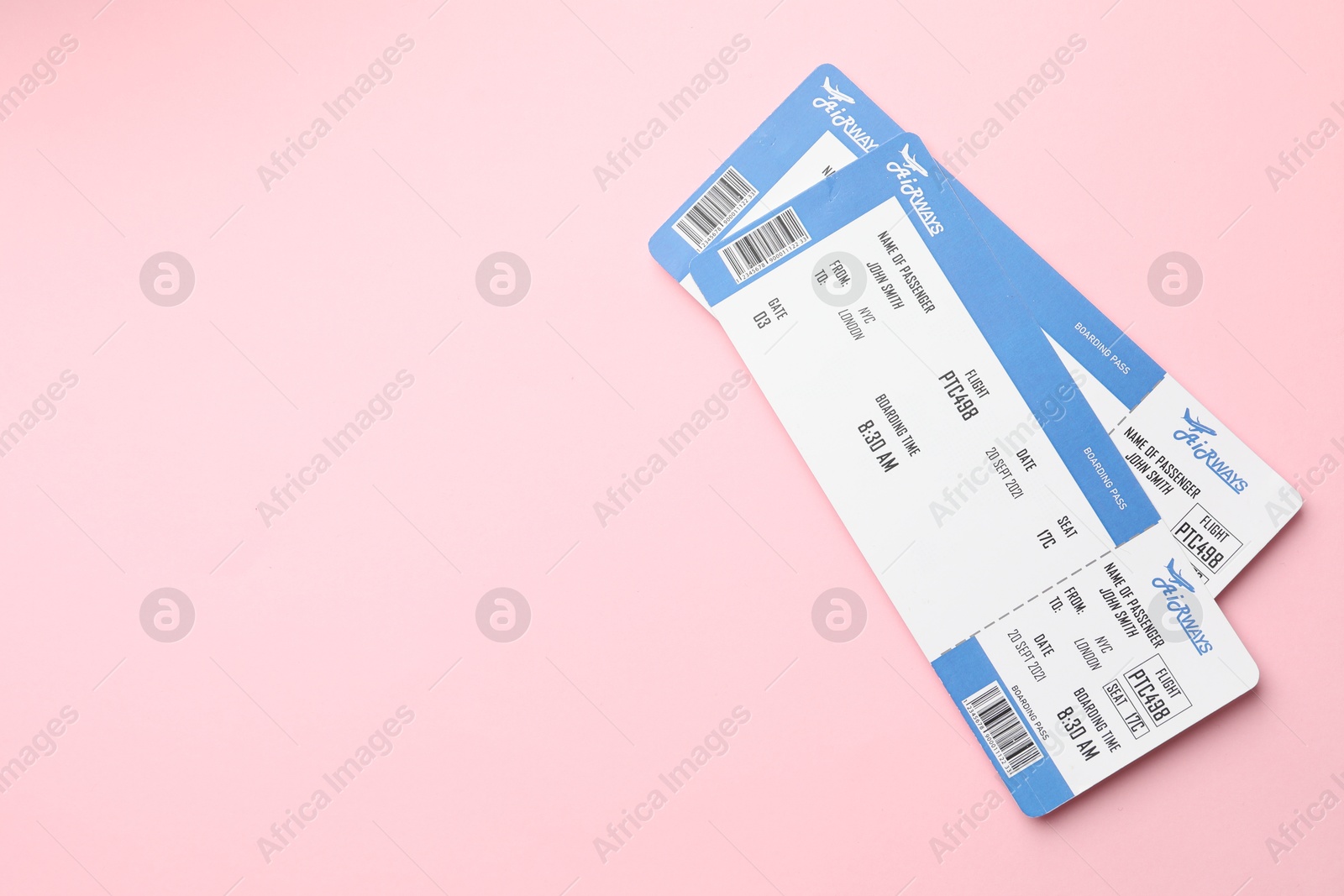 Photo of Travel agency. Flight tickets on pink background, top view. Space for text