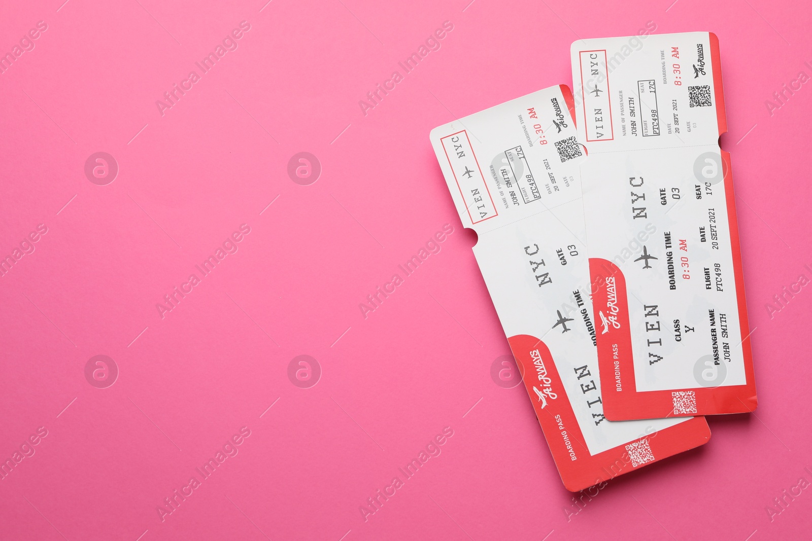 Photo of Travel agency. Flight tickets on pink background, top view. Space for text