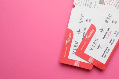 Photo of Travel agency. Flight tickets on pink background, top view. Space for text