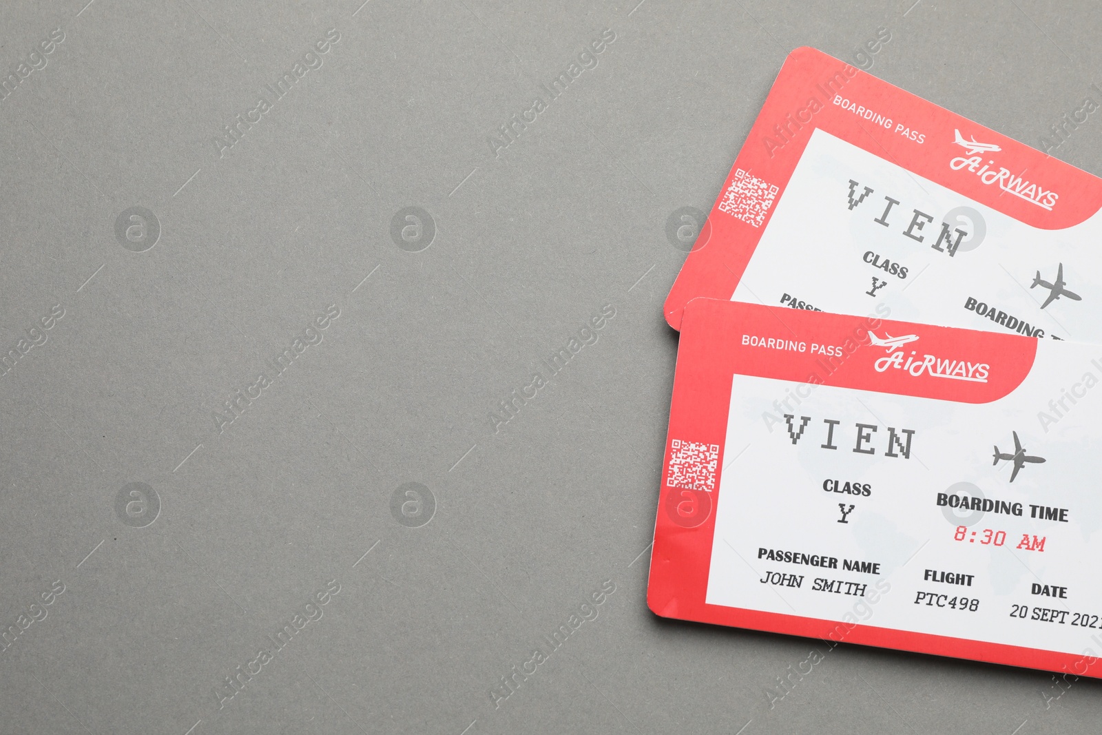 Photo of Travel agency. Flight tickets on grey background, top view. Space for text