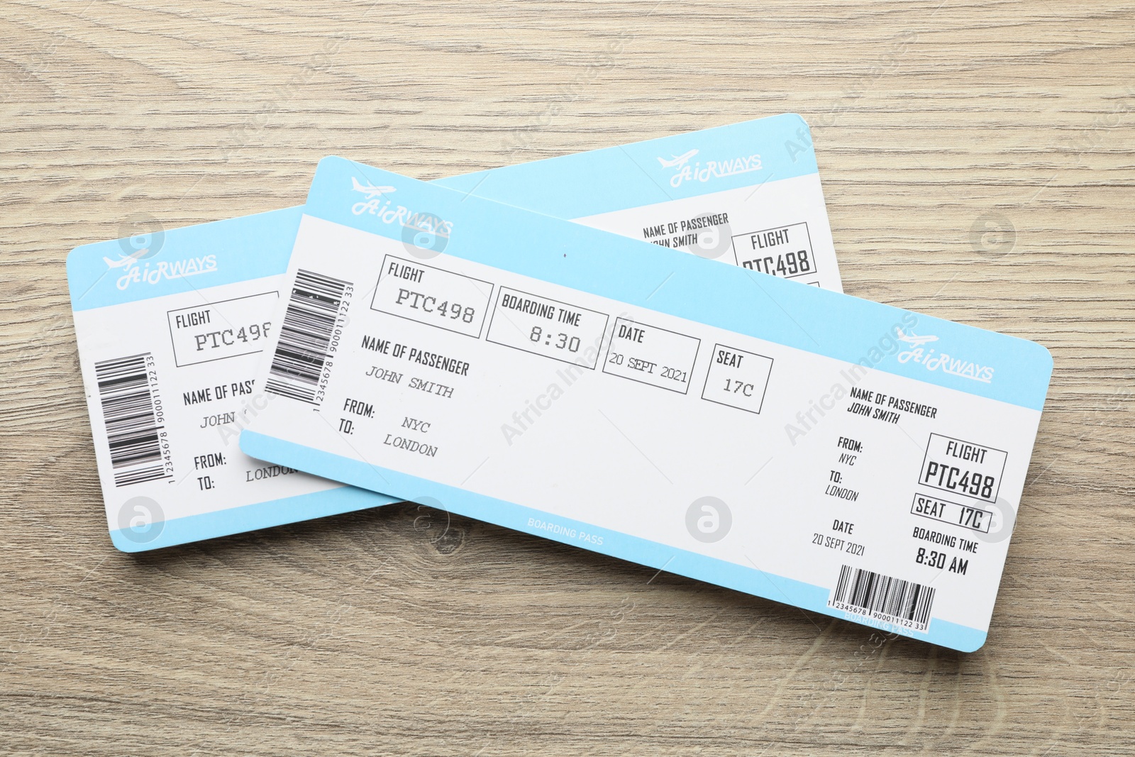 Photo of Travel agency. Flight tickets on wooden table, top view