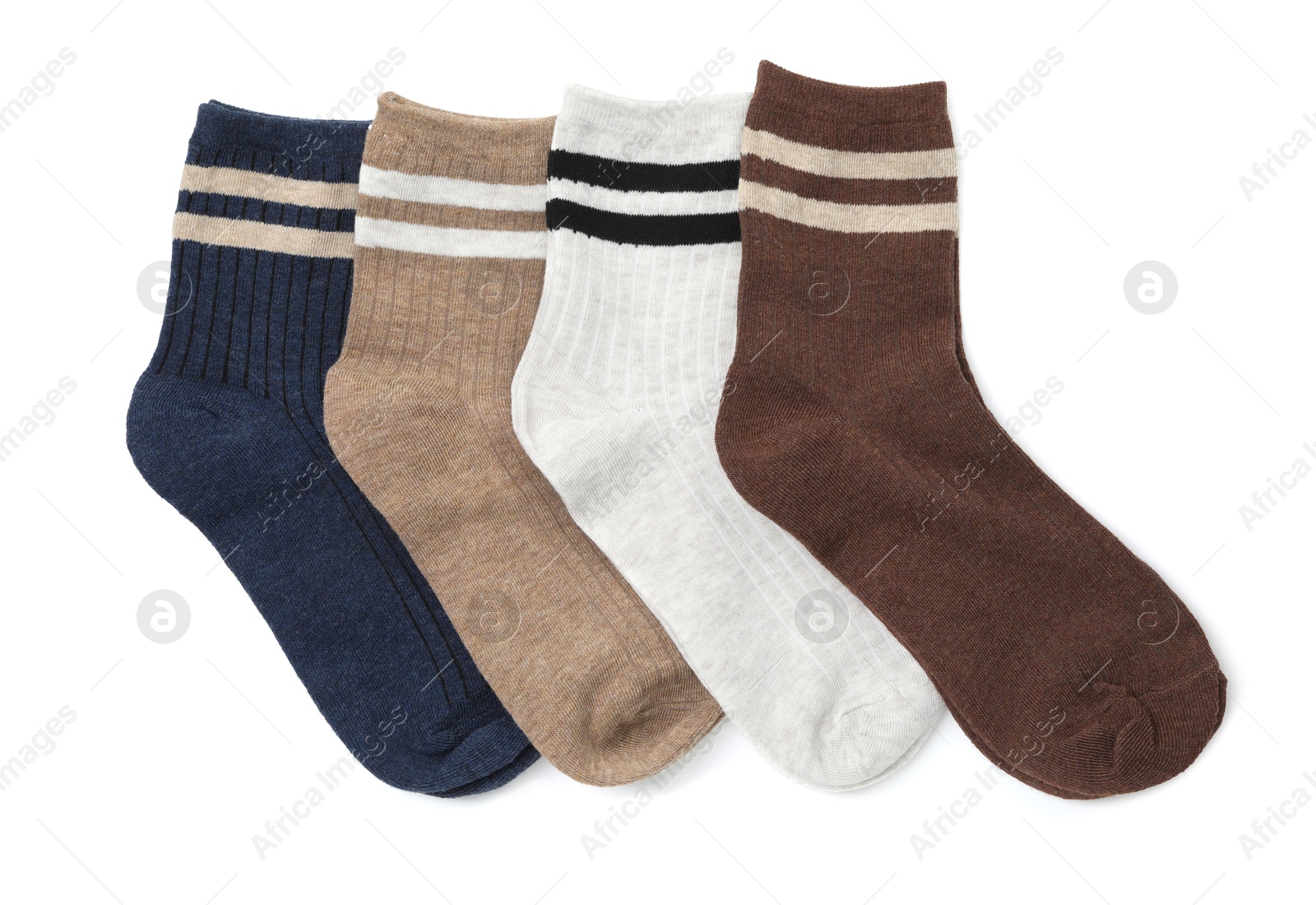 Photo of Different soft socks isolated on white, top view