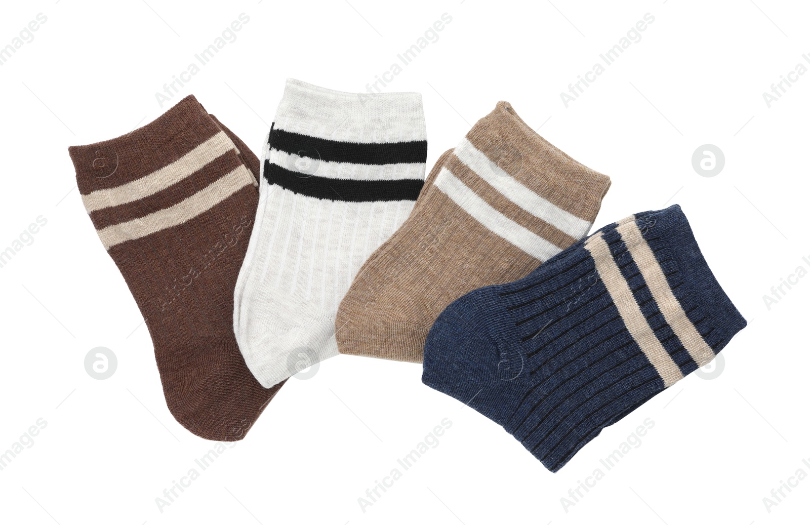 Photo of Pairs of folded soft socks isolated on white, top view