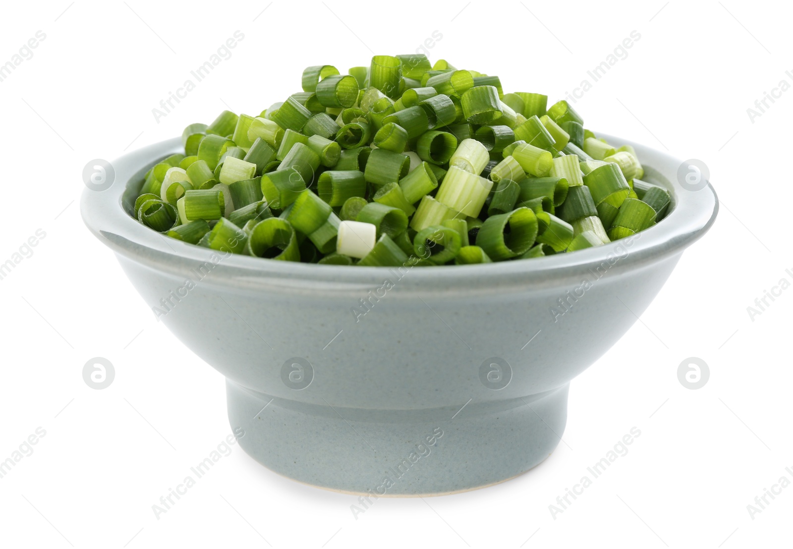 Photo of Chopped fresh green onion in bowl isolated on white