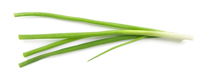 Photo of Fresh green onions isolated on white, top view