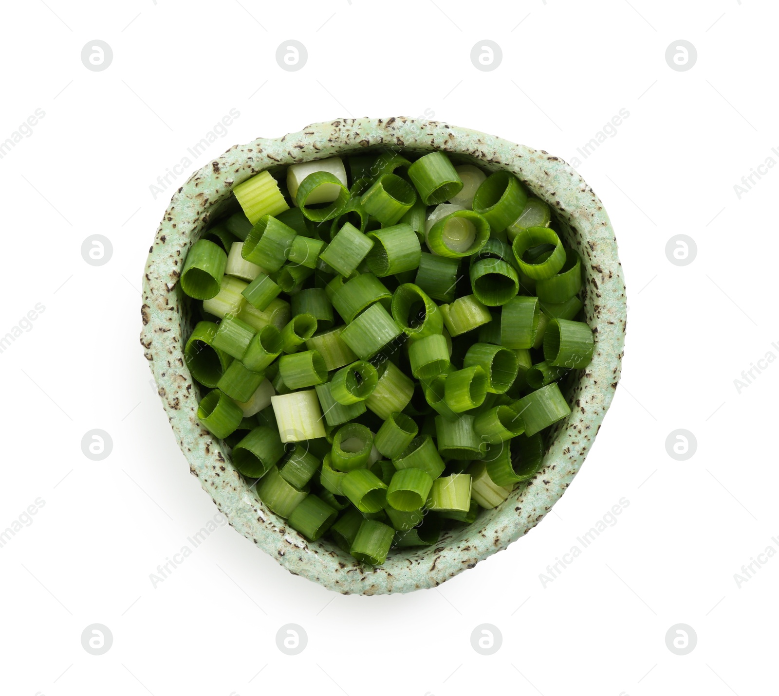 Photo of Chopped fresh green onion in bowl isolated on white, top view