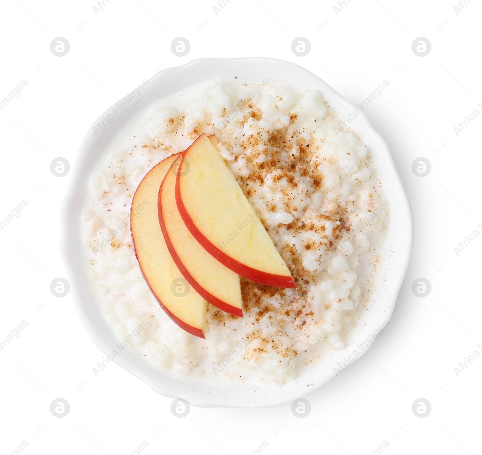 Photo of Delicious rice pudding with cinnamon and apple isolated on white, top view