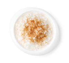 Photo of Delicious rice pudding with cinnamon isolated on white, top view