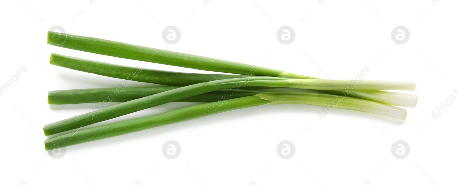 Photo of Fresh green onions isolated on white, top view