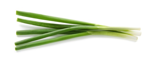 Photo of Fresh green onions isolated on white, top view