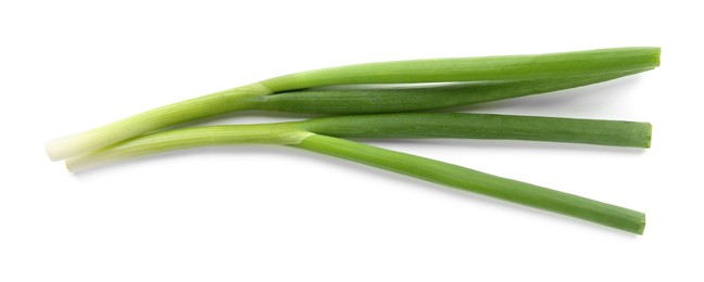 Photo of Fresh green onions isolated on white, top view