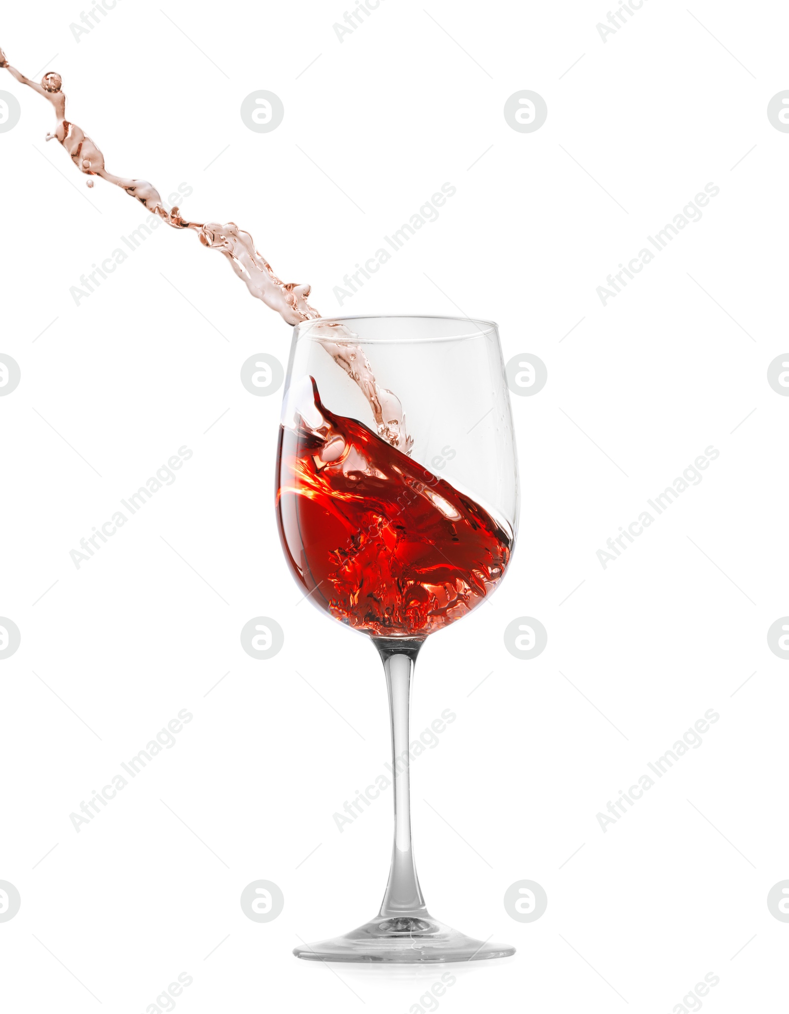 Photo of Rose wine splashing in glass on white background