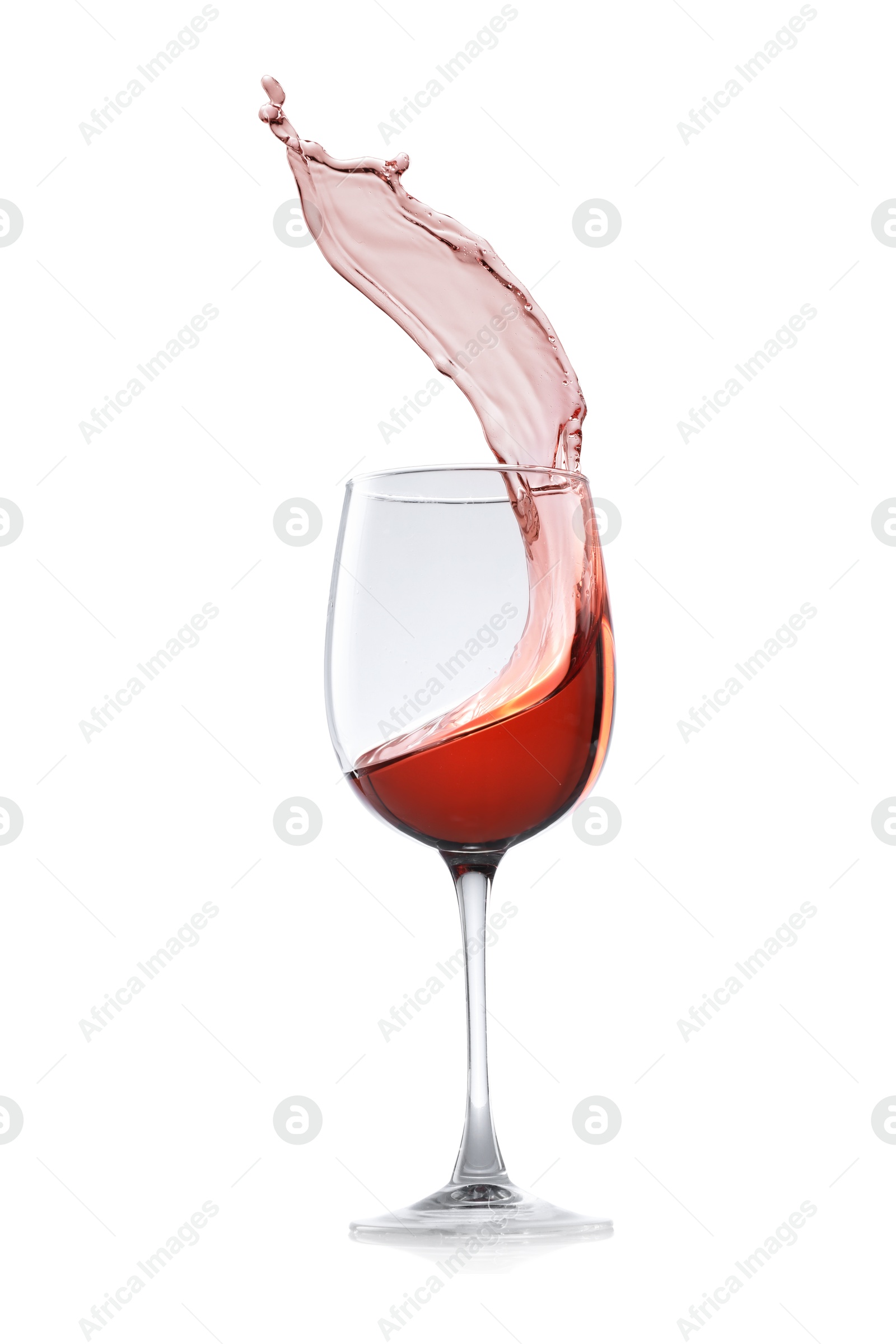 Photo of Rose wine splashing in glass on white background