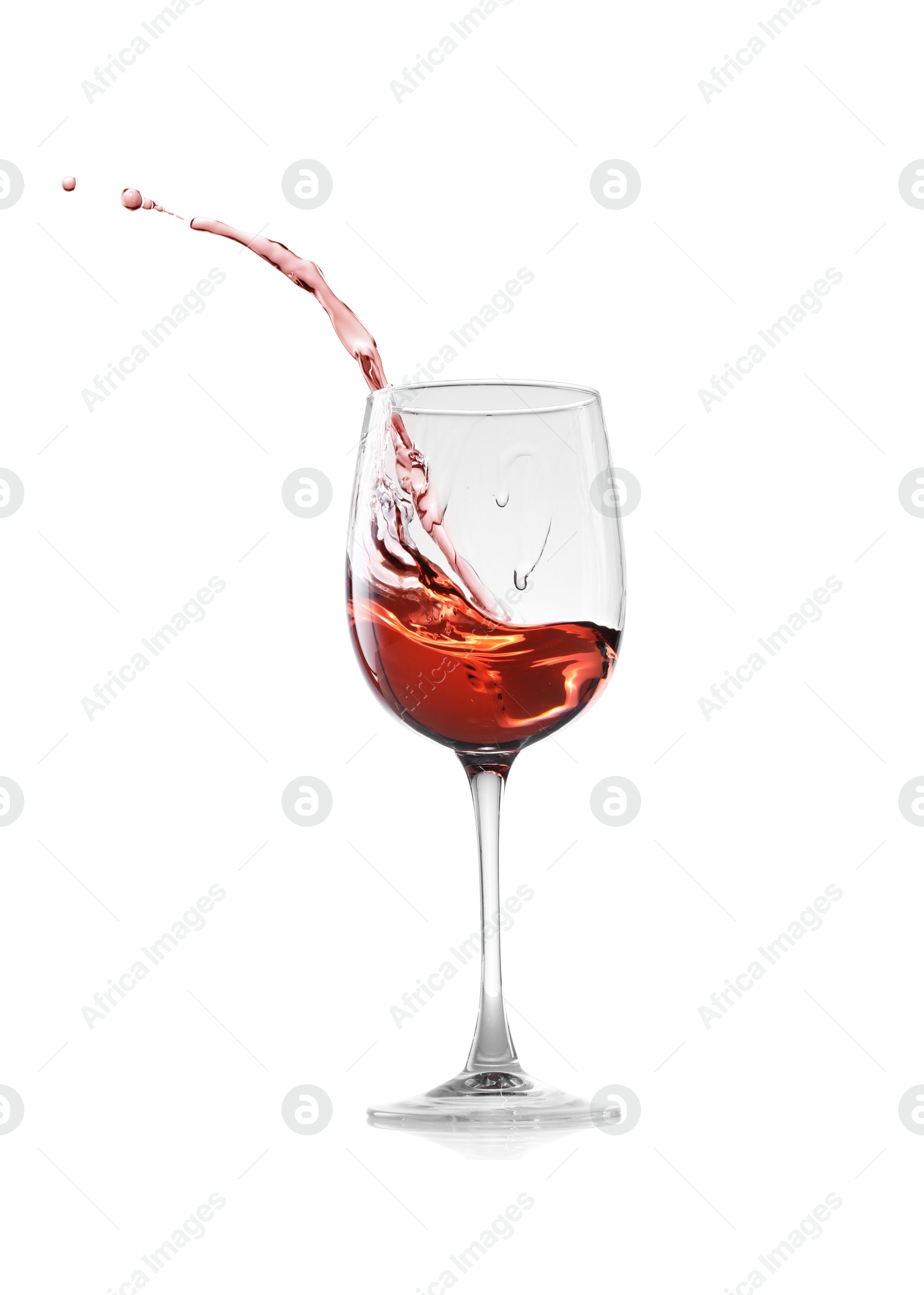 Photo of Rose wine splashing in glass on white background