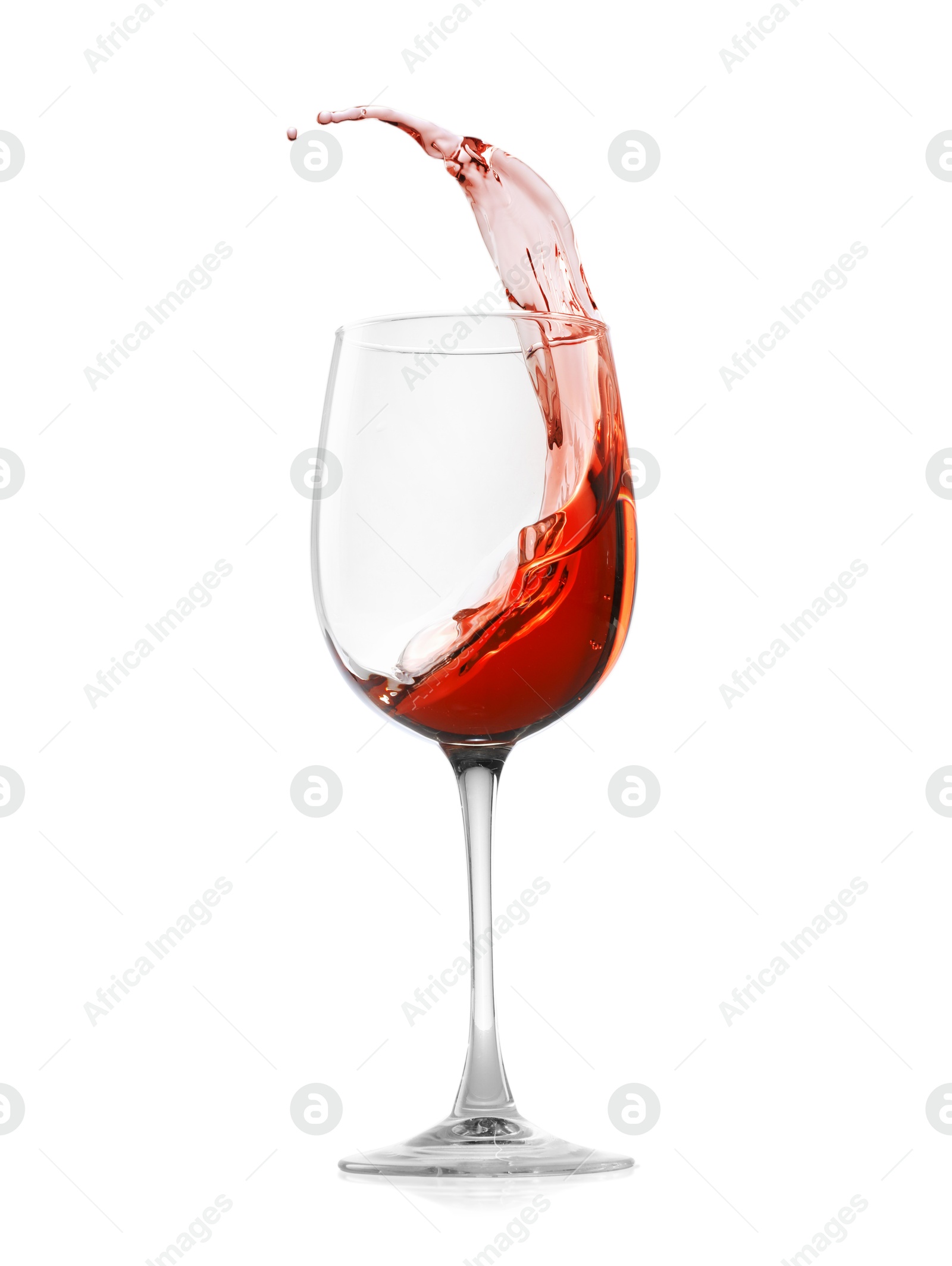 Photo of Rose wine splashing in glass on white background