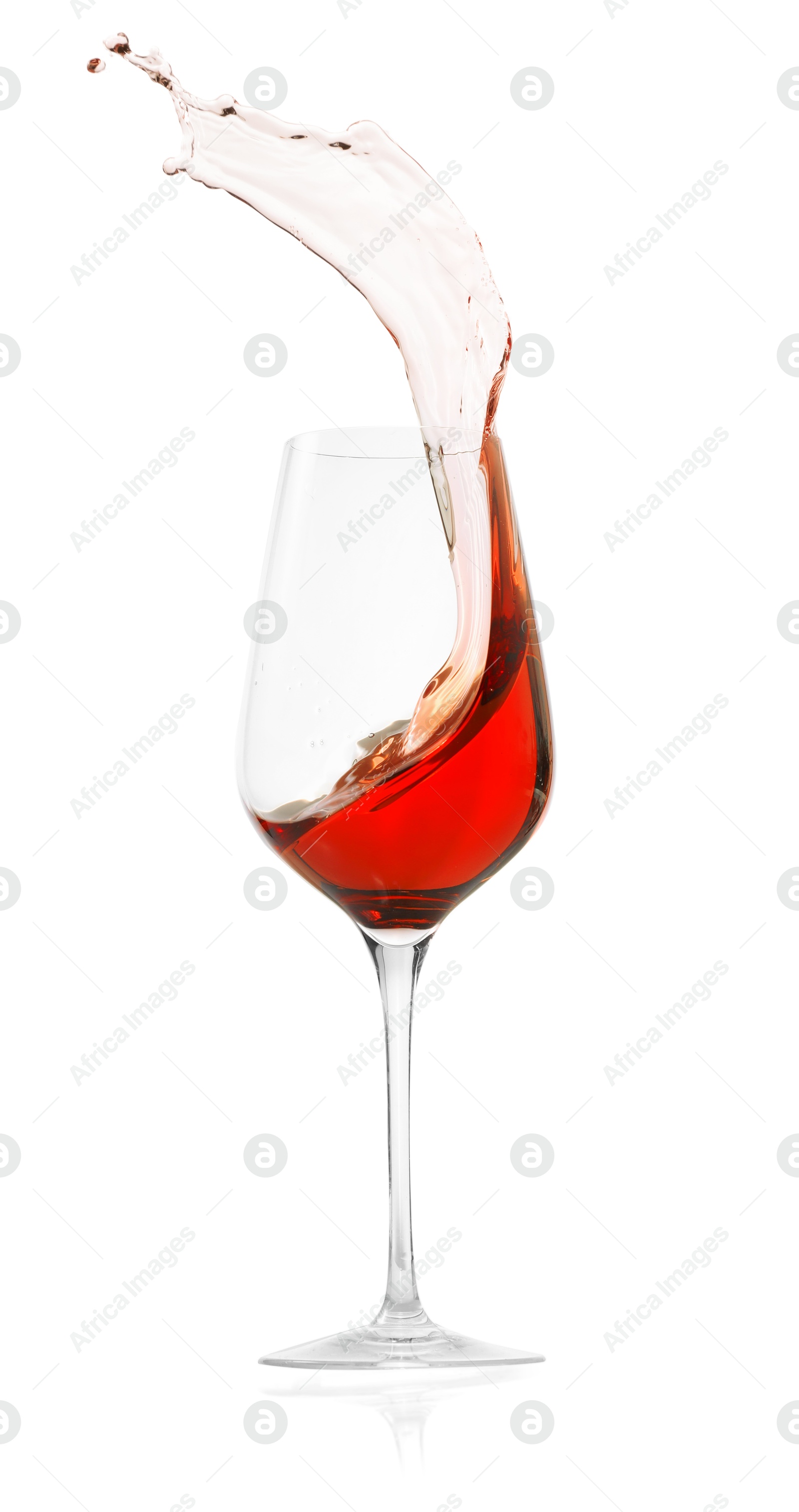 Photo of Rose wine splashing in glass on white background