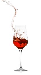 Photo of Rose wine splashing in glass on white background