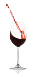 Photo of Red wine splashing in glass on white background