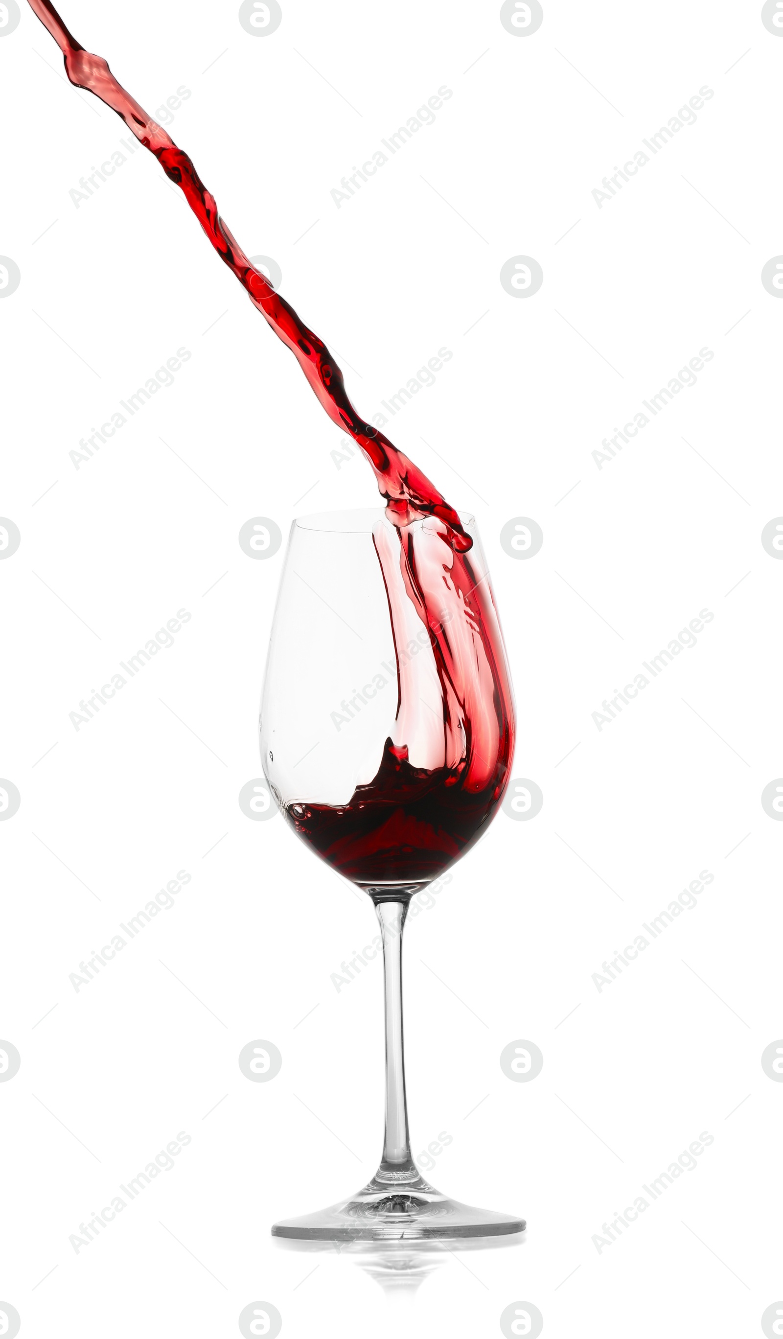 Photo of Red wine splashing in glass on white background