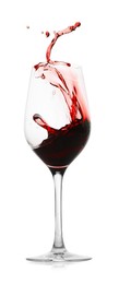 Photo of Red wine splashing in glass on white background