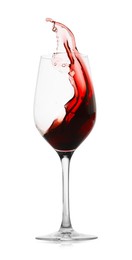 Photo of Red wine splashing in glass on white background