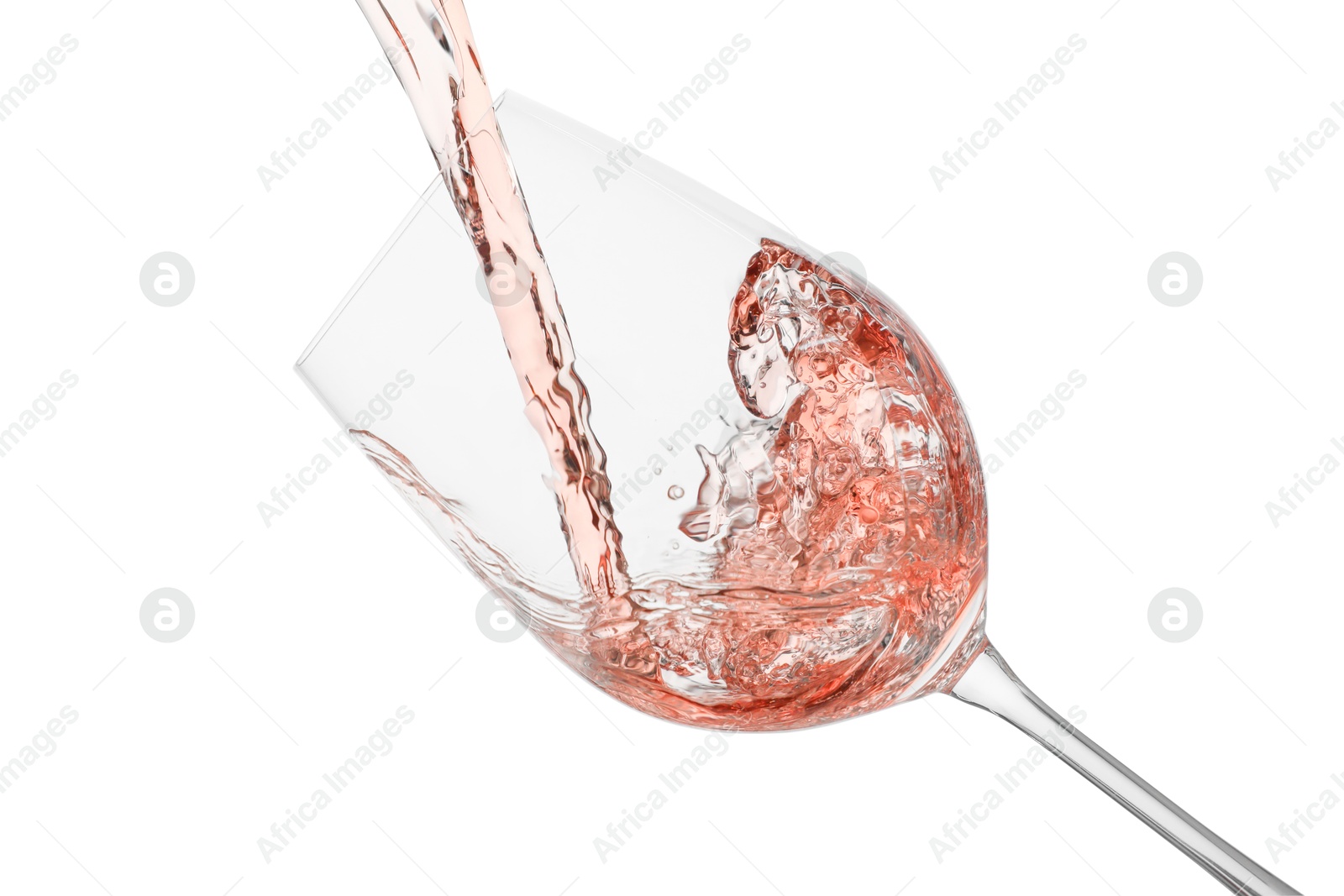 Photo of Pouring rose wine into glass on white background