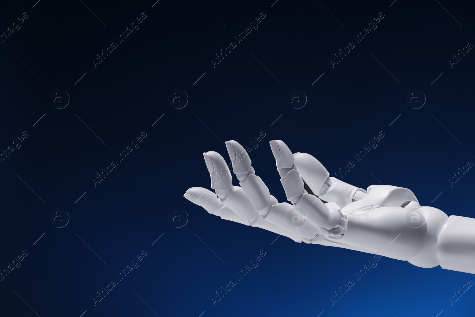 Photo of Artificial intelligence. Robot hand gesturing on dark blue background, space for text