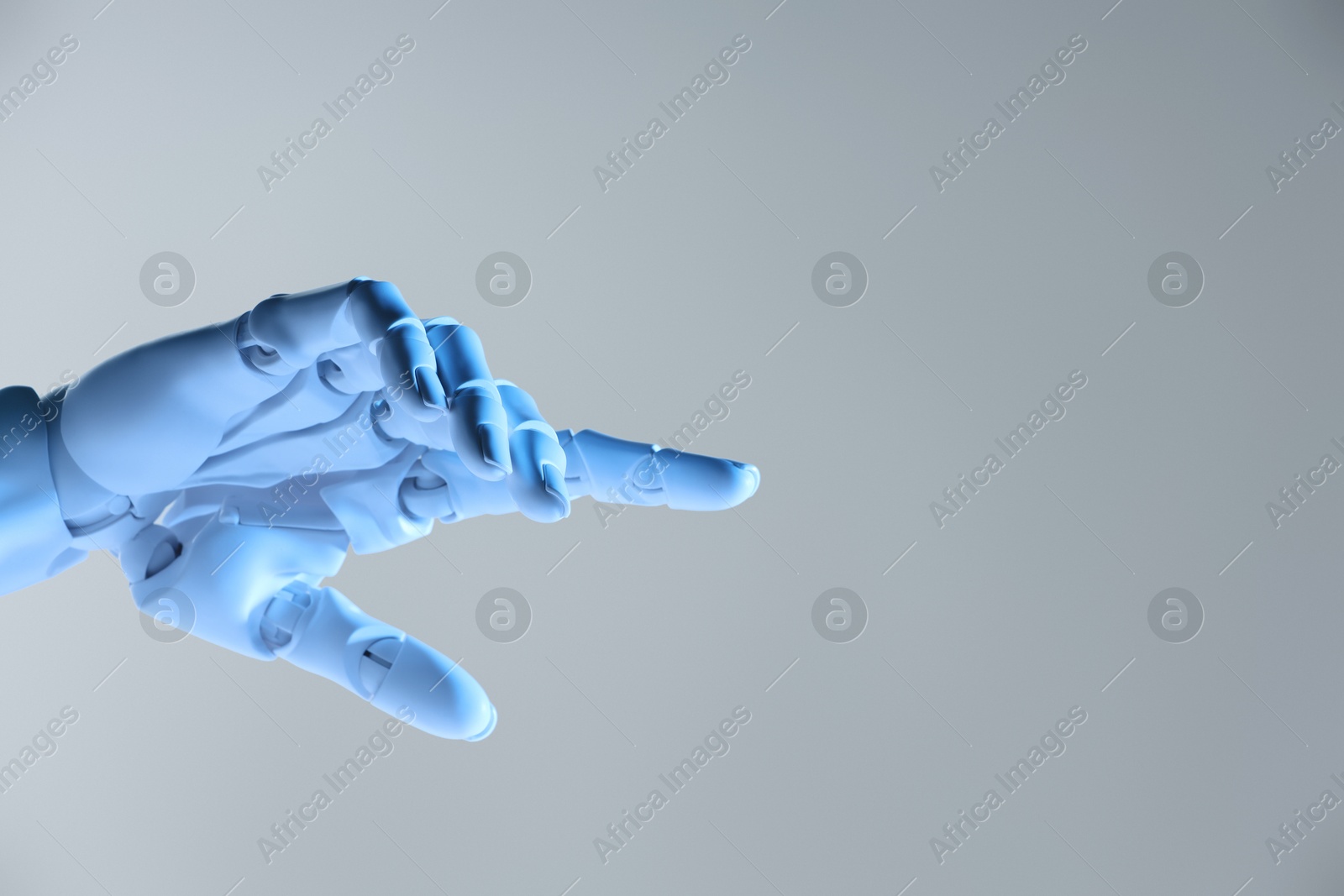 Photo of Artificial intelligence. Robot hand pointing at something on grey background, space for text