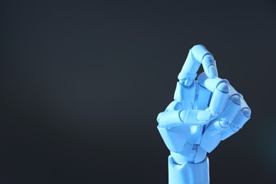 Photo of Artificial intelligence. Robot hand gesturing on grey background, space for text