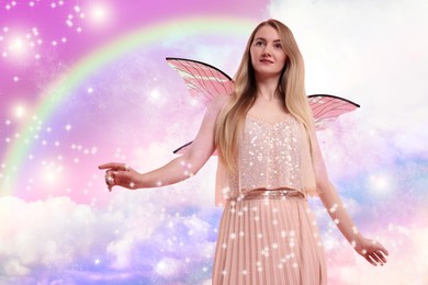 Image of Ethereal fairy under fluffy clouds and rainbow in colorful sky. Beautiful girl with wings among magic lights