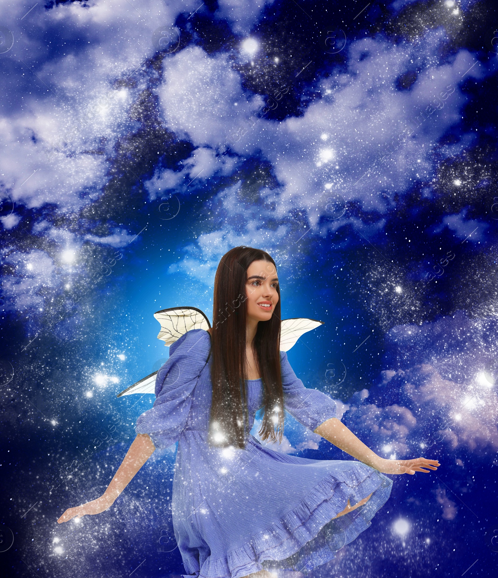 Image of Enchanting fairy among clouds in dark sky. Beautiful girl with wings