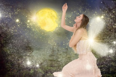 Image of Enchanting fairy in forest sparkling with magic lights under full moon. Beautiful girl with wings