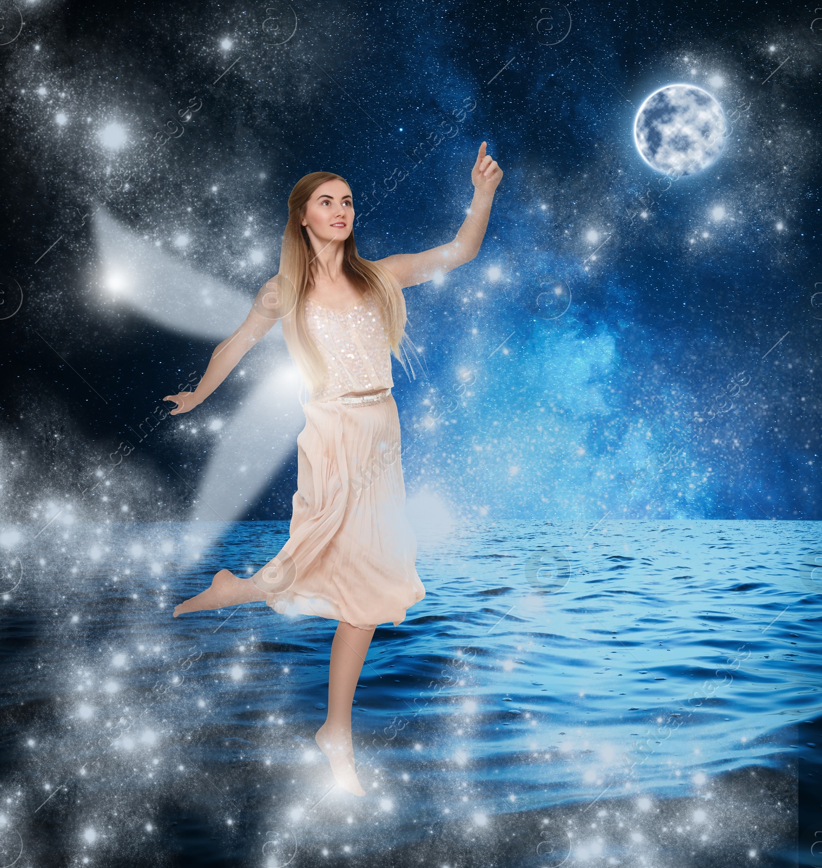 Image of Enchanting fairy walking on water among magic lights under full moon. Beautiful girl with wings