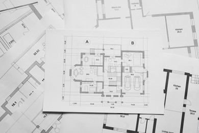 Photo of Different architectural drawings as background, top view