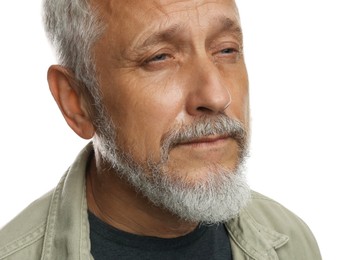 Photo of Sad senior man crying on white background, closeup