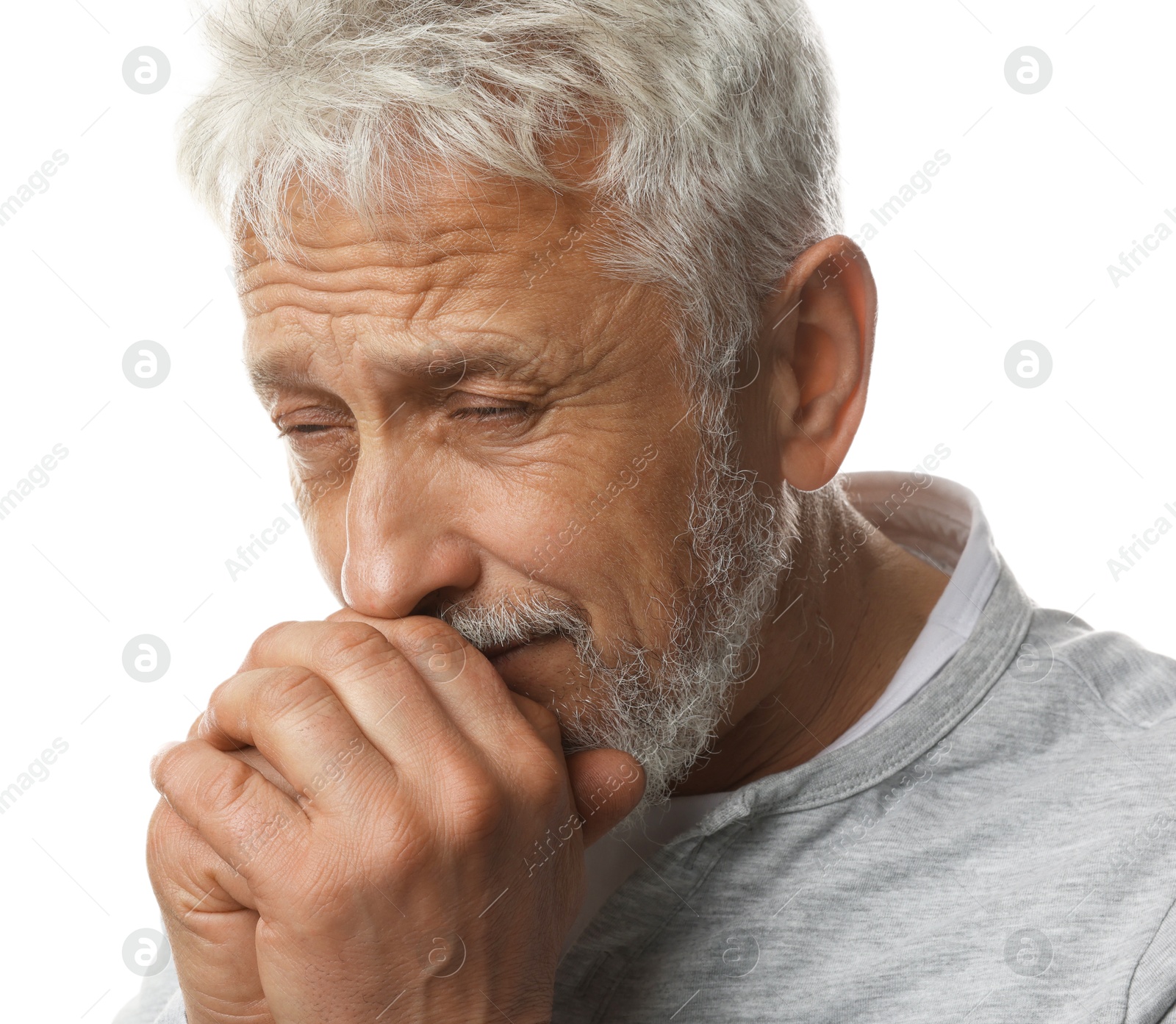 Photo of Sad senior man crying on white background