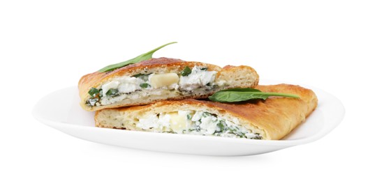 Photo of Pieces of tasty calzone with cheese and basil isolated on white